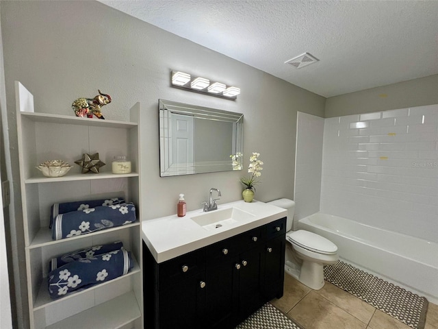 full bath with a textured ceiling, toilet, visible vents, vanity, and tile patterned floors