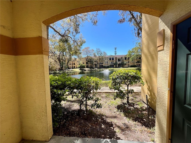 view of yard with a water view and a residential view