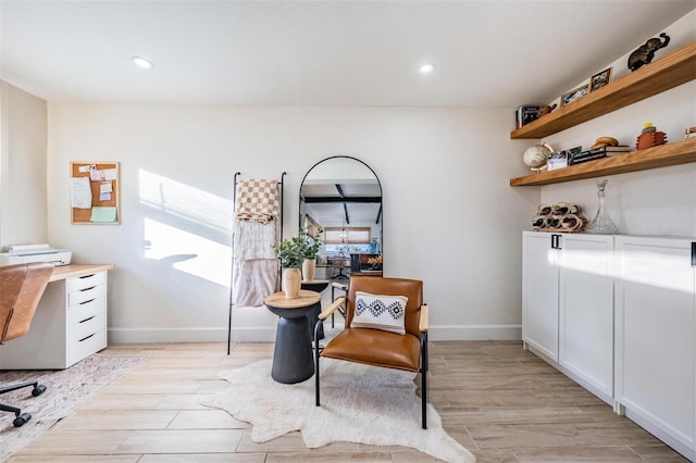 office featuring light wood-type flooring, baseboards, and recessed lighting