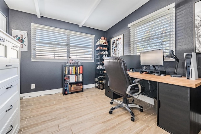 home office featuring wood tiled floor, baseboards, and beam ceiling