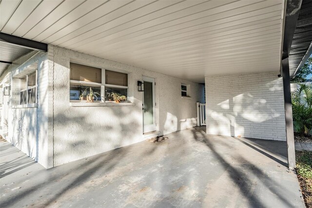 view of patio / terrace with a carport