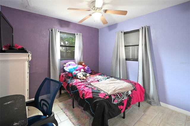 bedroom with baseboards and ceiling fan