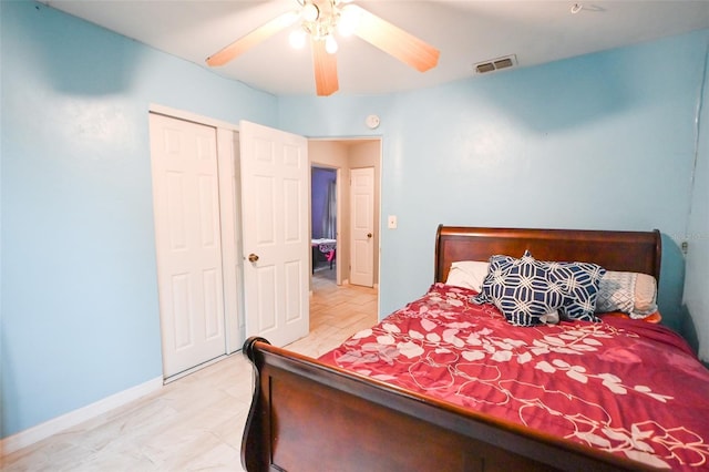 bedroom featuring a closet, visible vents, baseboards, and a ceiling fan