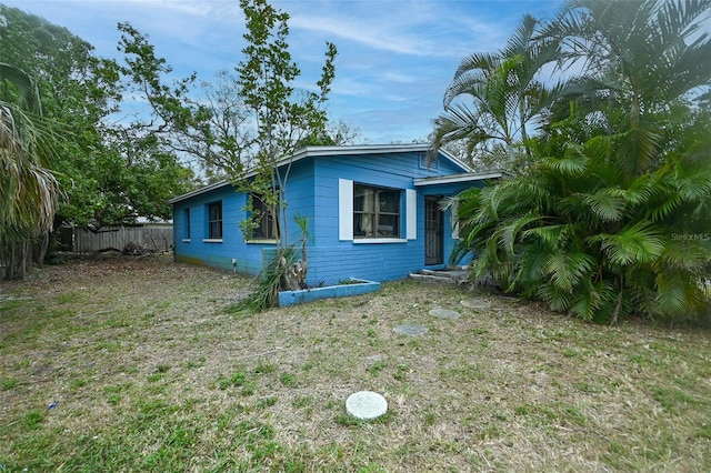 view of property exterior featuring fence