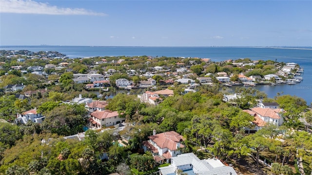 drone / aerial view with a water view and a residential view