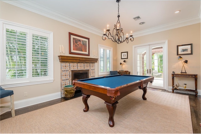 recreation room featuring dark wood-type flooring, french doors, and a healthy amount of sunlight