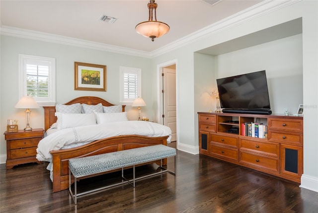 bedroom with crown molding, multiple windows, visible vents, and wood finished floors