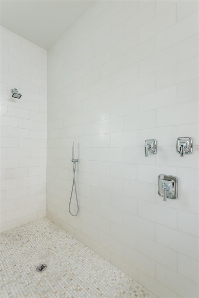 bathroom with tiled shower