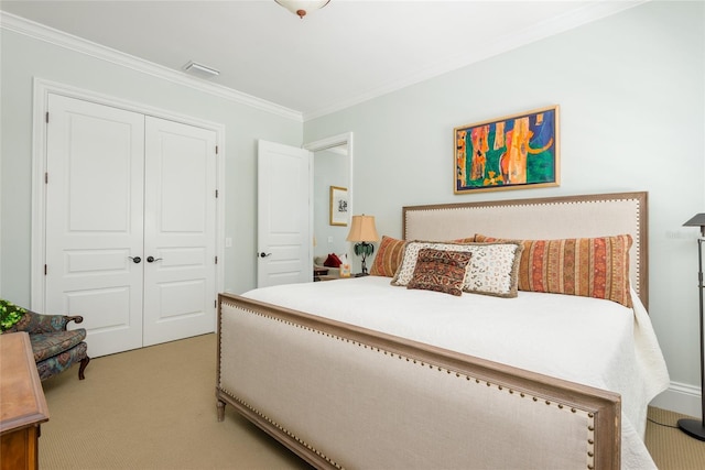 bedroom with light carpet, ornamental molding, a closet, and visible vents