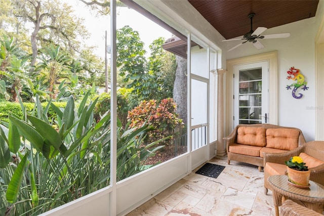 sunroom / solarium with ceiling fan