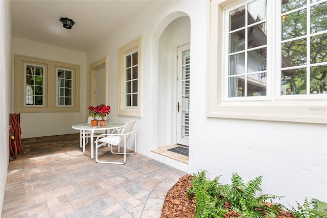 exterior space with a patio and stucco siding