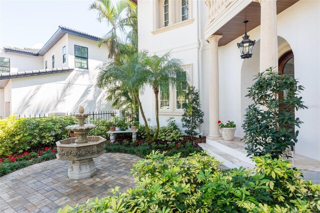 doorway to property featuring stucco siding