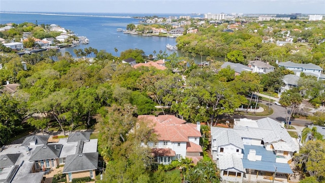 birds eye view of property with a water view and a residential view