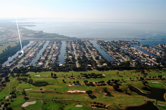 drone / aerial view featuring a water view and golf course view