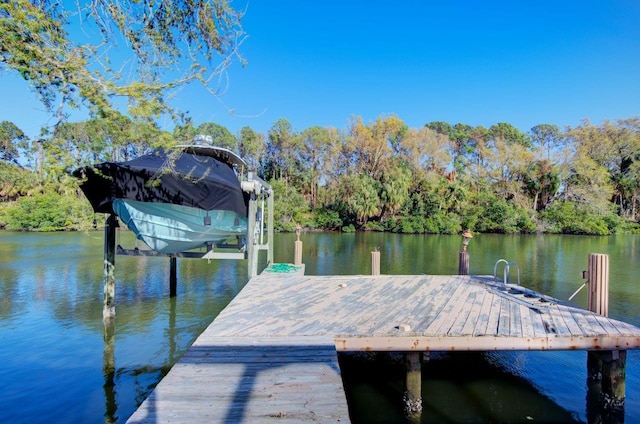 view of dock featuring a water view and boat lift