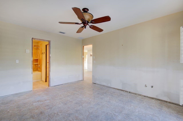 spare room with visible vents and ceiling fan