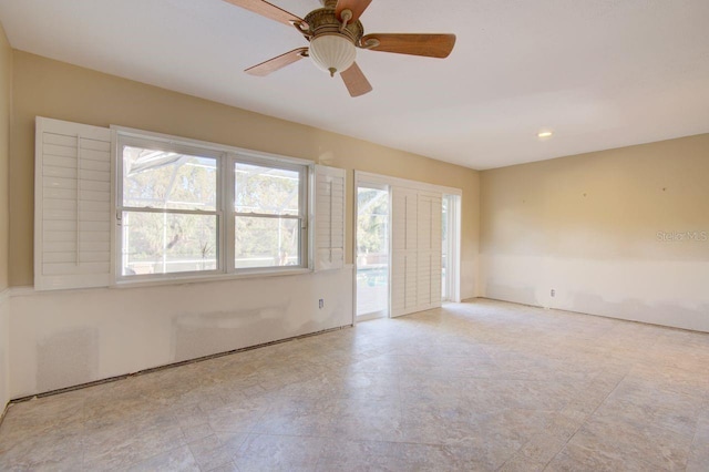 unfurnished room featuring ceiling fan