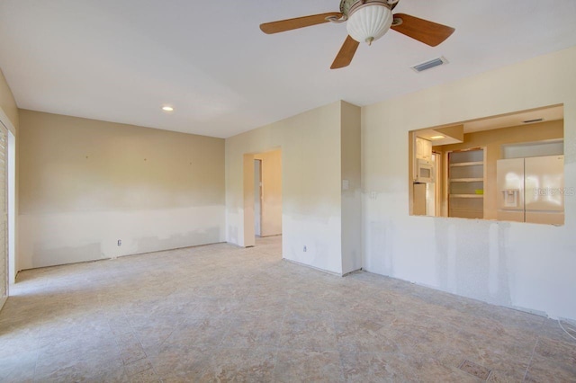 unfurnished room featuring visible vents