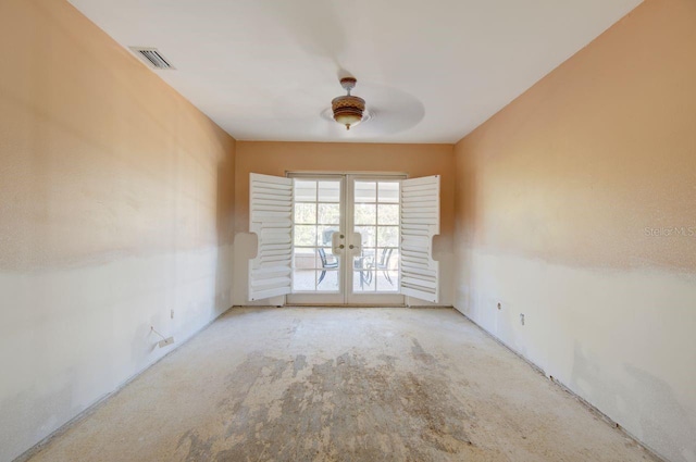 unfurnished room with visible vents and french doors