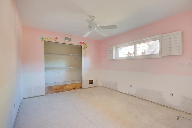 spare room with ceiling fan and visible vents