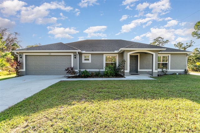 ranch-style house with a garage, concrete driveway, a front lawn, and stucco siding