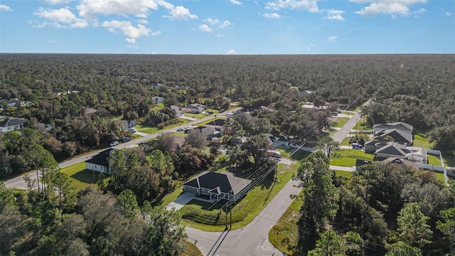 bird's eye view featuring a forest view