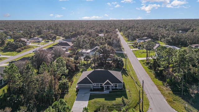 drone / aerial view with a view of trees