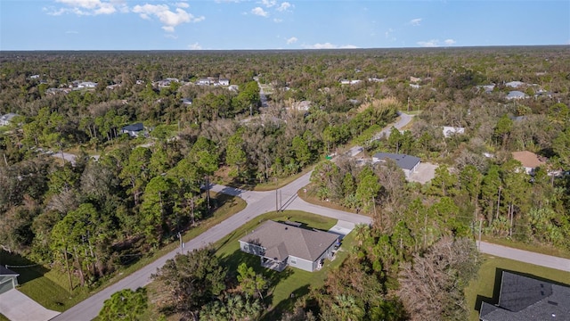 bird's eye view featuring a view of trees