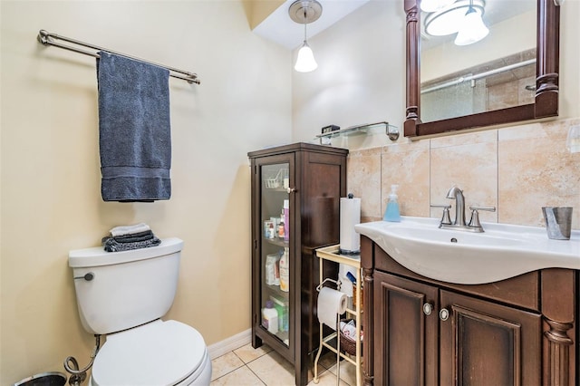 bathroom with decorative backsplash, tile patterned flooring, vanity, and toilet