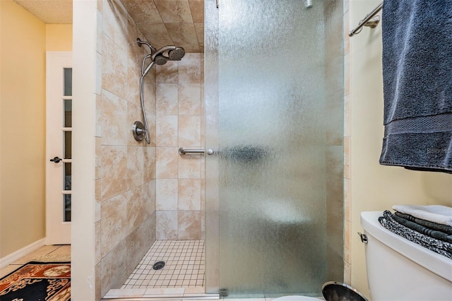 full bathroom with a stall shower and toilet