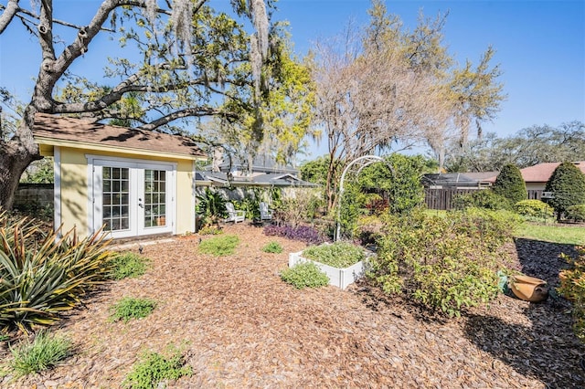 view of yard featuring french doors