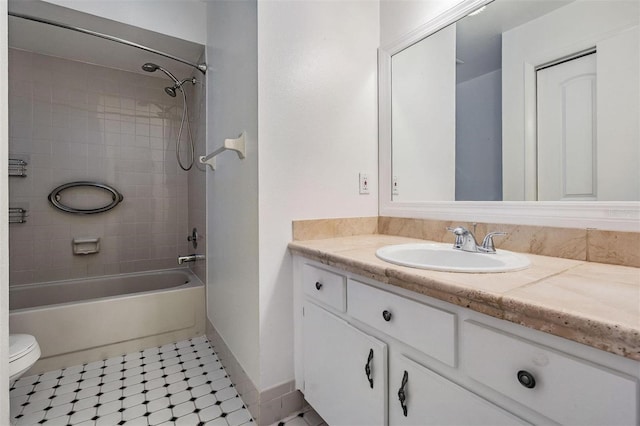 full bath with toilet, bathtub / shower combination, baseboards, and vanity