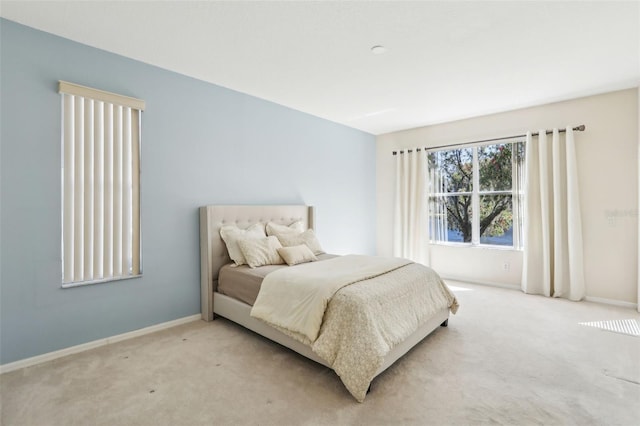 bedroom with carpet floors and baseboards