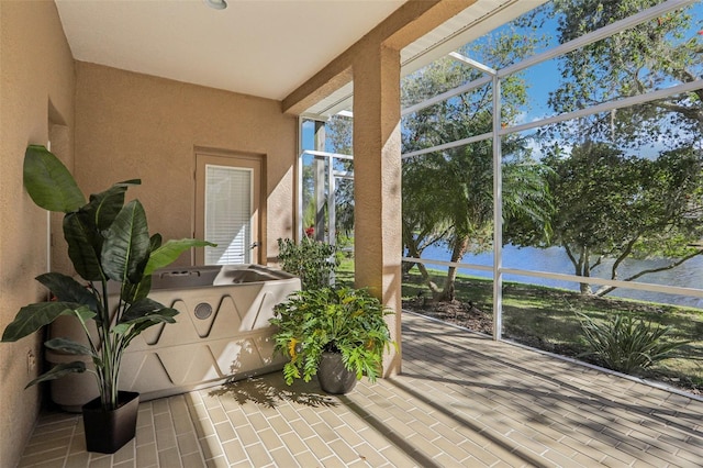 sunroom with a water view
