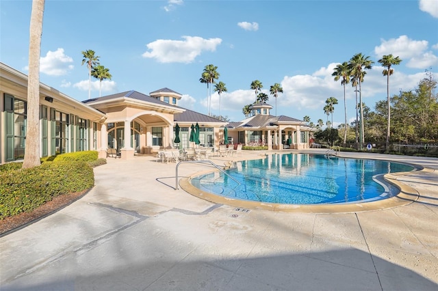 community pool with a patio