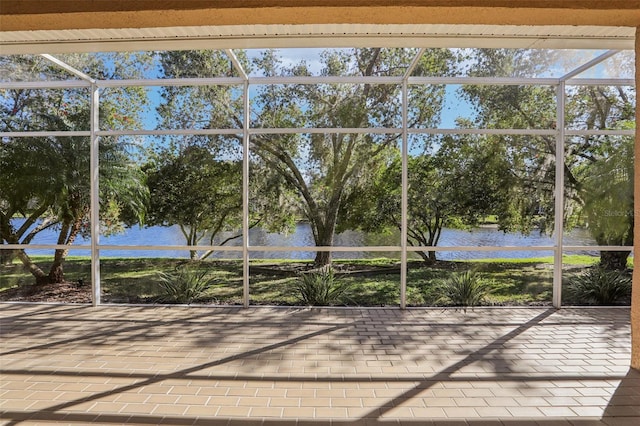 10211 Quails Landing Ave, Tampa, FL 33647 - unfurnished sunroom featuring a water view and view of scattered trees