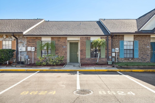 view of property featuring uncovered parking