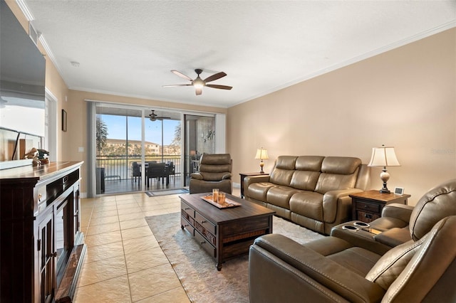 living room featuring a ceiling fan, crown molding, and a textured ceiling