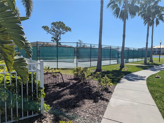 view of tennis court with fence