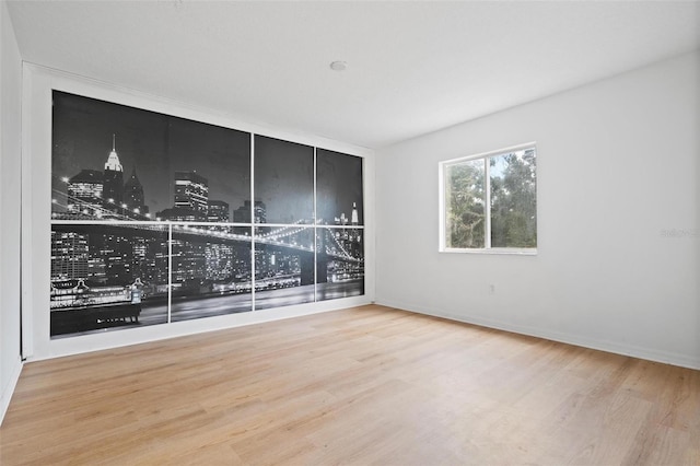 empty room with wood finished floors