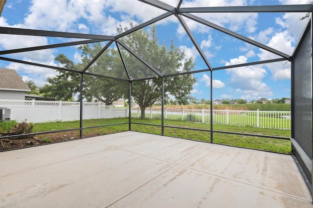 view of patio / terrace with glass enclosure and fence