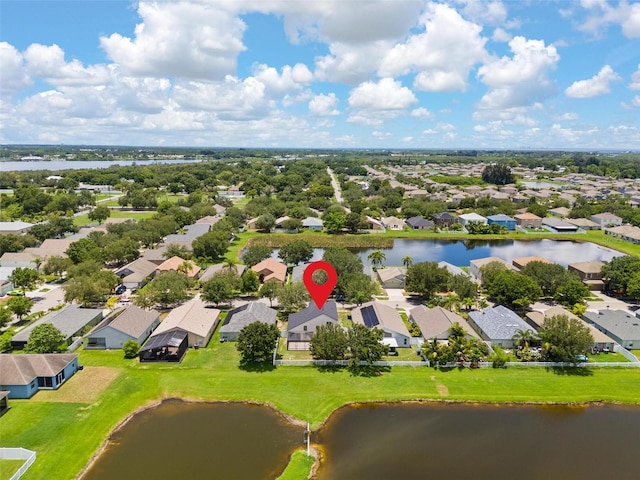 birds eye view of property with a residential view and a water view