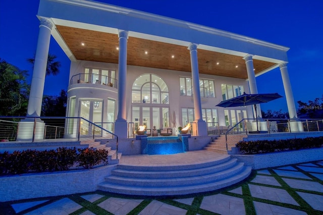 exterior space featuring stairway and a balcony