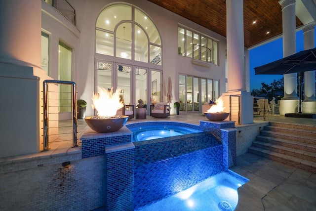 view of swimming pool with a patio area and an in ground hot tub