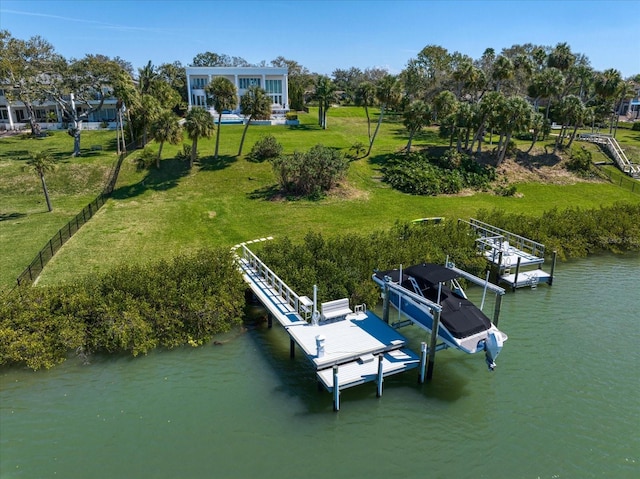 dock area featuring a yard, a water view, and boat lift