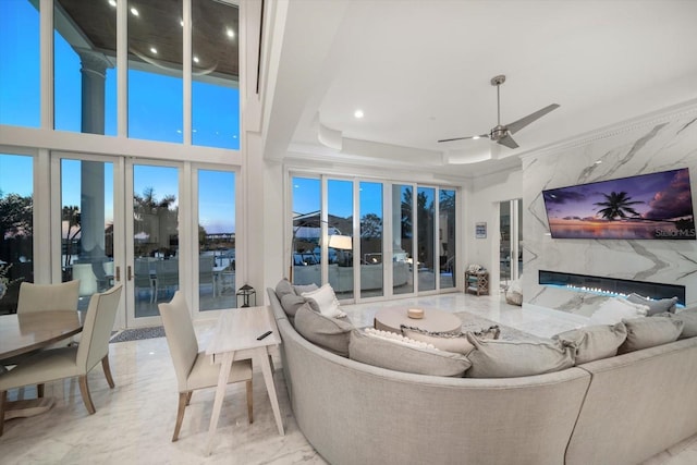 living room featuring a ceiling fan, a high end fireplace, marble finish floor, and recessed lighting