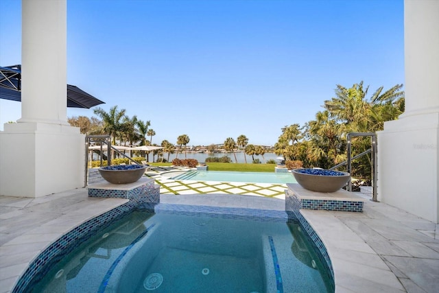 view of swimming pool with a water view