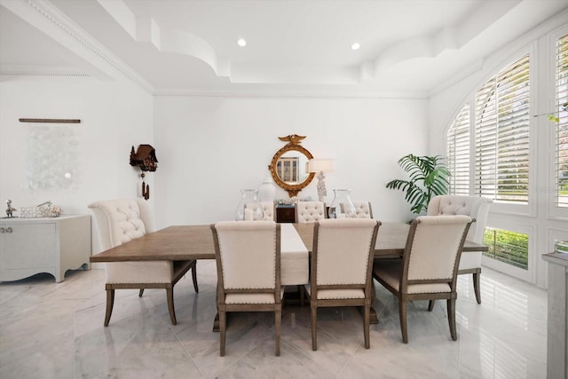 dining area featuring recessed lighting, marble finish floor, crown molding, and a tray ceiling