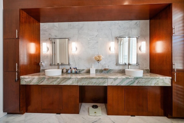 full bathroom with double vanity and a sink