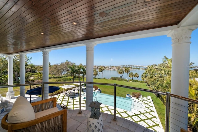 balcony featuring a water view